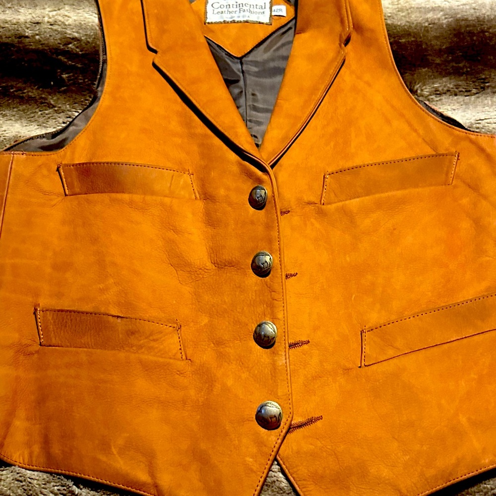Brand new all Leather vest.  Buffalo nickel buttons. Perfect condition.